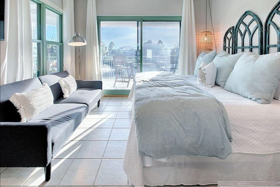 Sink into plush linens and wake to stunning mountain views from your bright, airy suite with cozy seating nook.