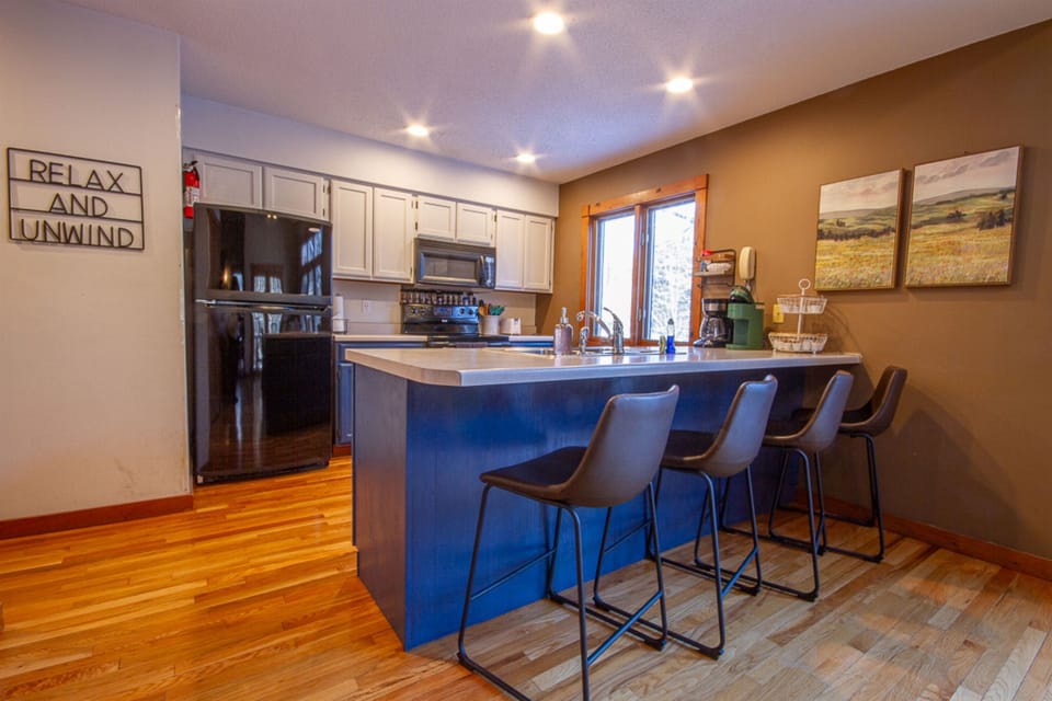 Pull up a chair with a hot cup of coffee while breakfast is being whipped up.