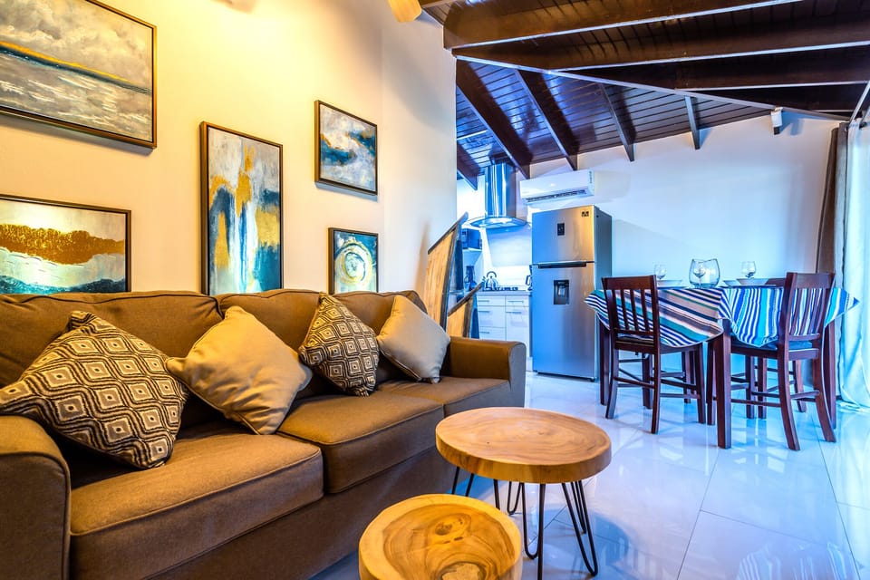Eclat Living Area of the Apartment in Noord Aruba - Comfy sofas - Smart TV and Netflix - Artfully arranged decor elements, from wall art to decorative accessories