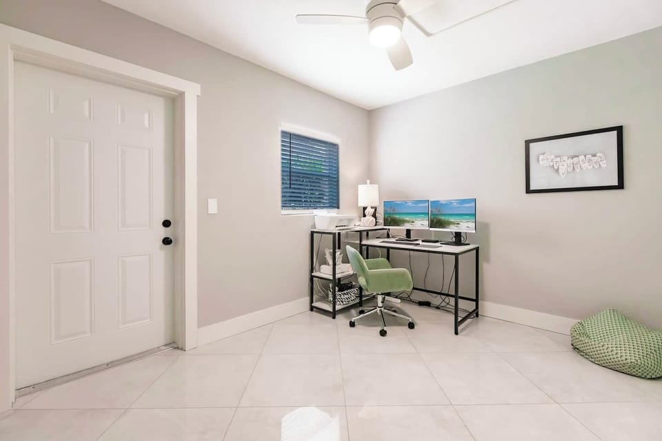 Private office off the Master Bedroom that includes two screens, a docking station and a printer should you have to work.