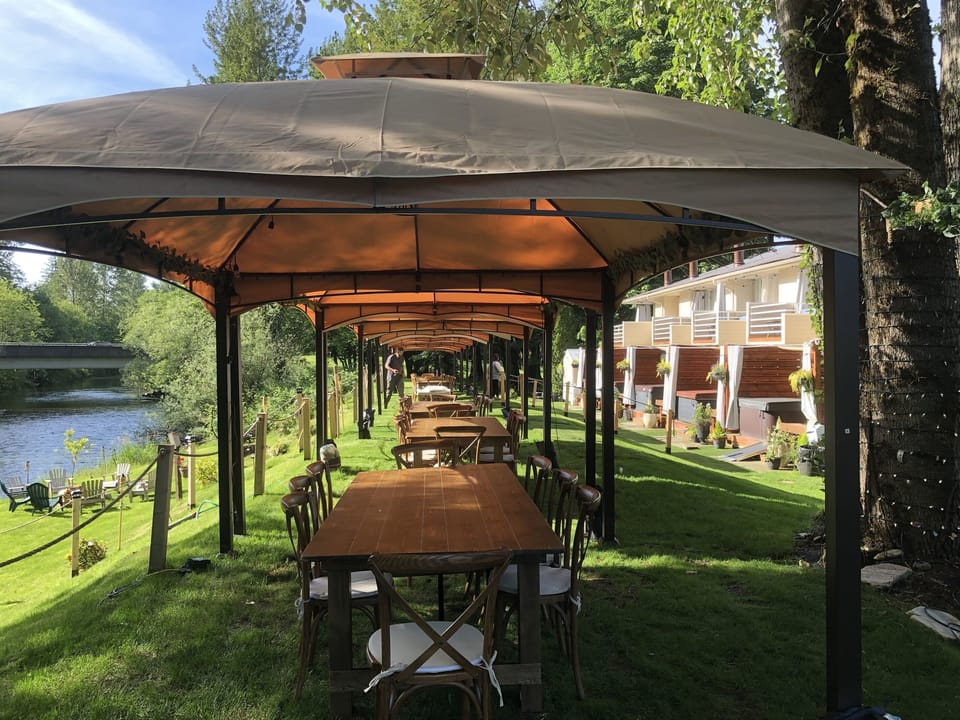 8 covered gazebos with farm tables and chairs