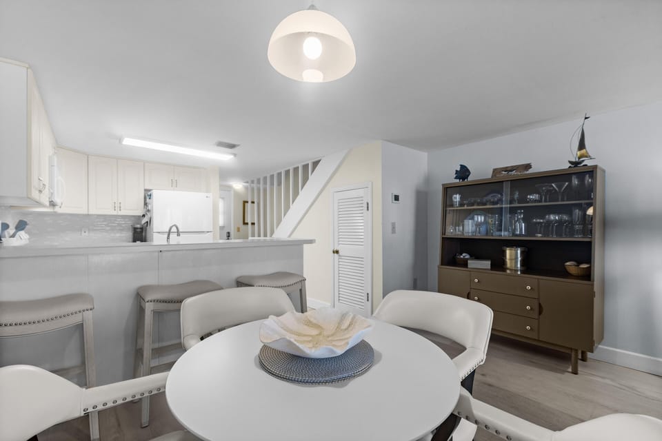 Bright and airy dining area with modern kitchen access