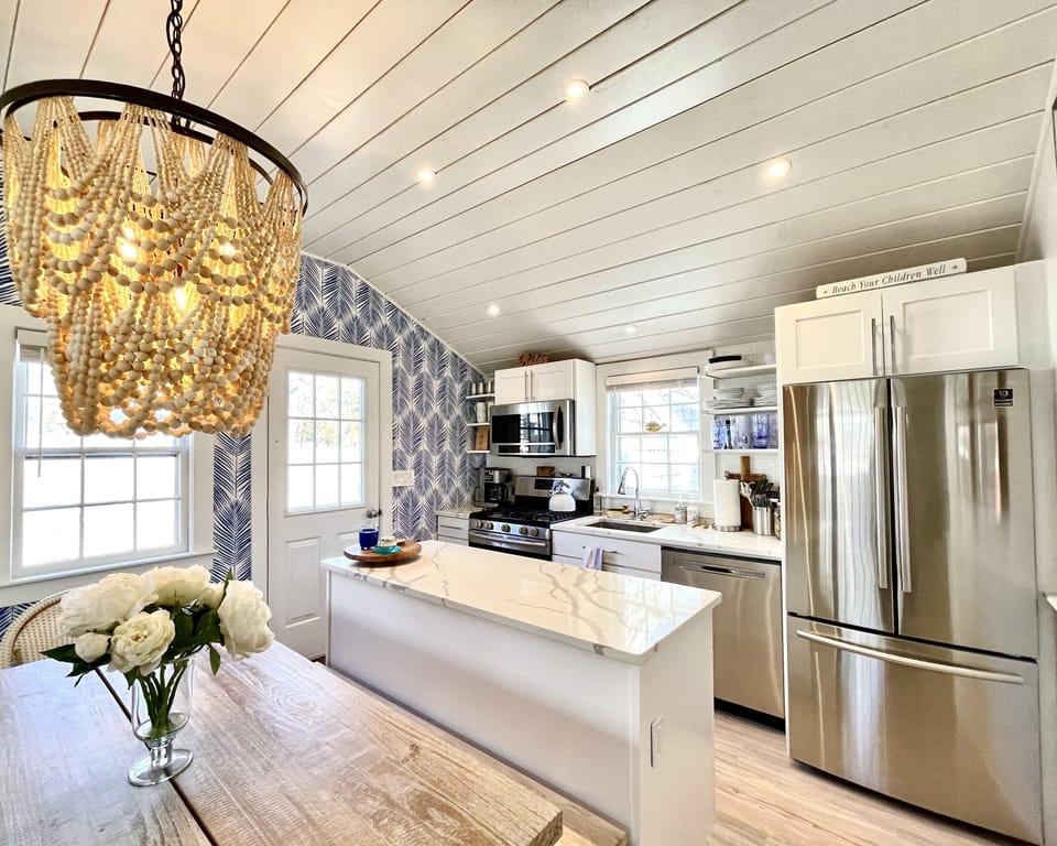 Pottery Barn chandelier, seating for 8! Beautiful coastal decor!