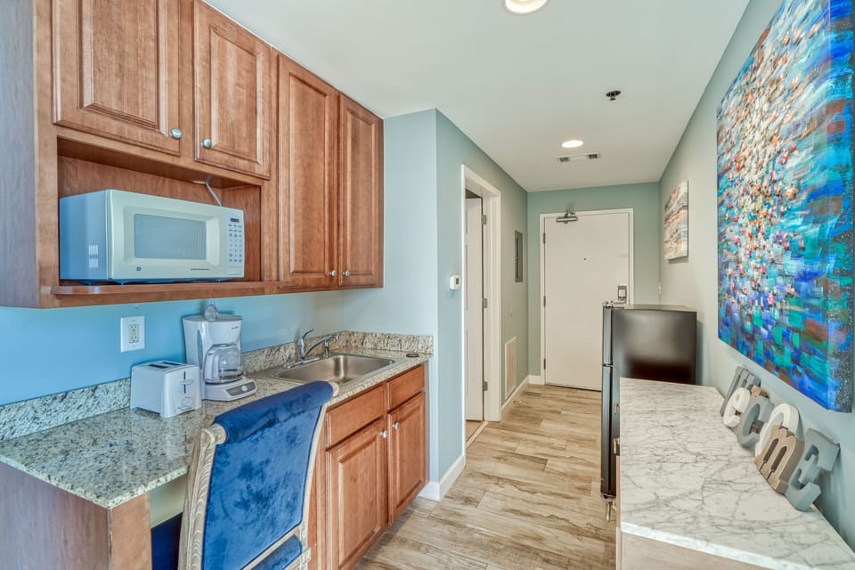 King bed and sleeper sofa (sleeps 3), bathroom, kitchenette, private balcony