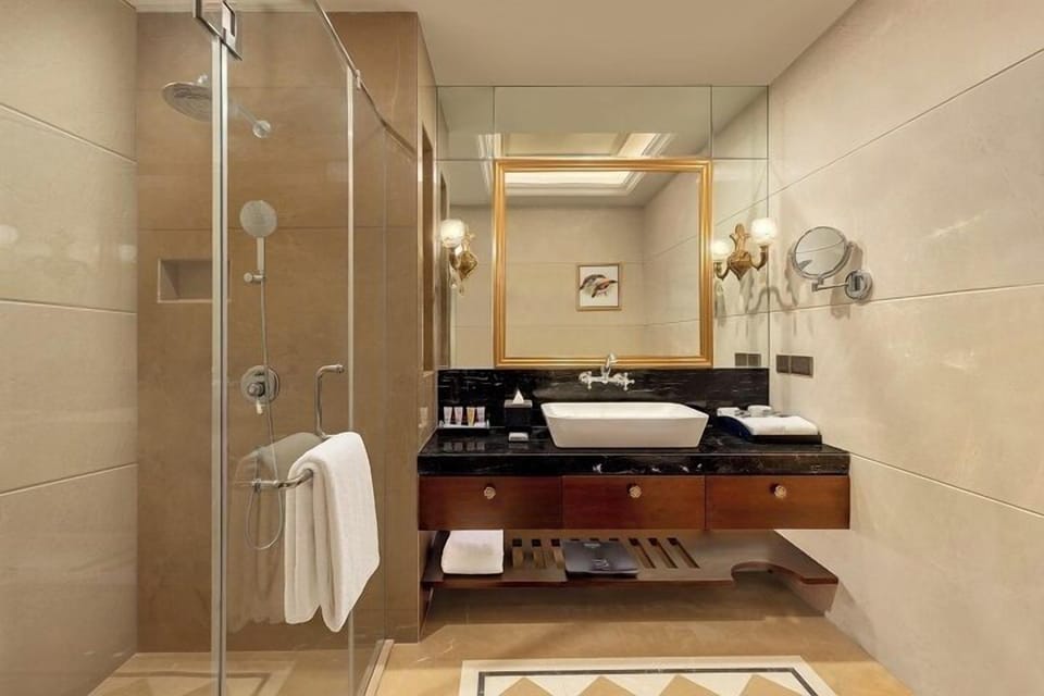 Deep soaking tub, designer toiletries, hair dryer, bathrobes