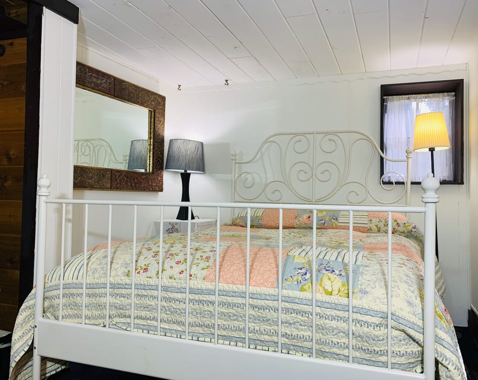 Full/Double size bed with feather pillows and duvet.