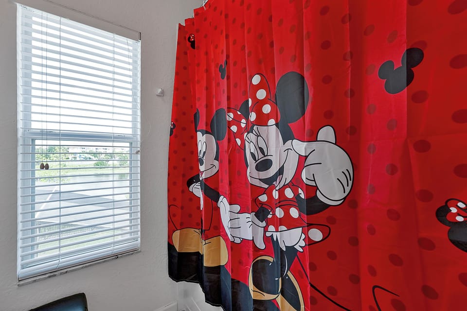 Mickey and Minnie shared bathroom with shower and seperate toilet area