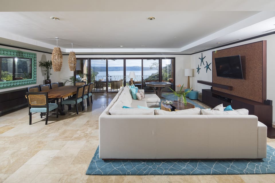 Open living and dining room with Sonos sound. 