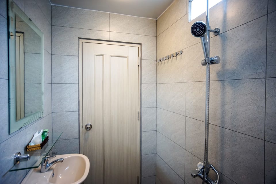 Shower, free toiletries, hair dryer, slippers