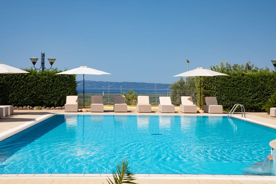 Seasonal outdoor pool, pool umbrellas, sun loungers