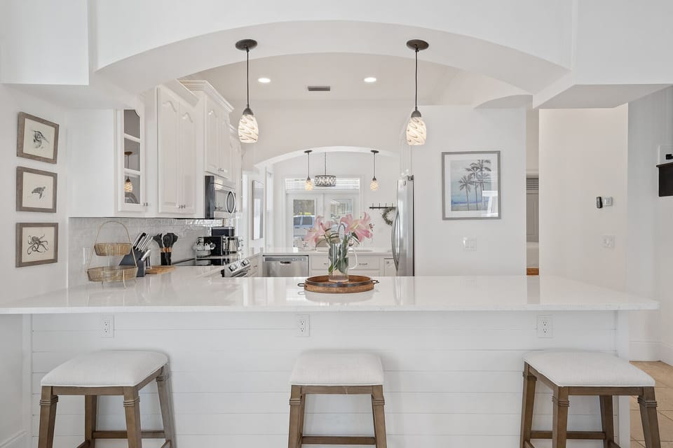 Beautiful, Spacious Fully Equipped Kitchen with Plenty of Seating at both Breakfast Bars