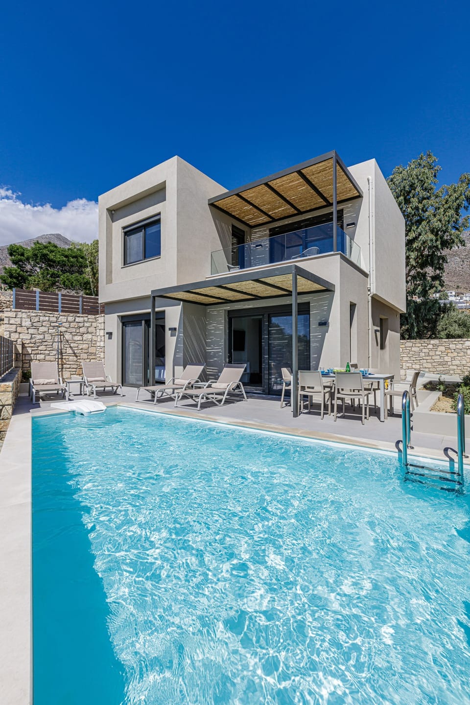 Porti Iraklis 1 with a contemporary design, fully equipped, with a private pool awaits to offer you unique moments