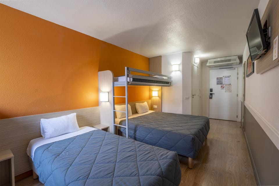 Standard Room, Multiple Beds | Individually furnished, desk, laptop workspace, blackout drapes