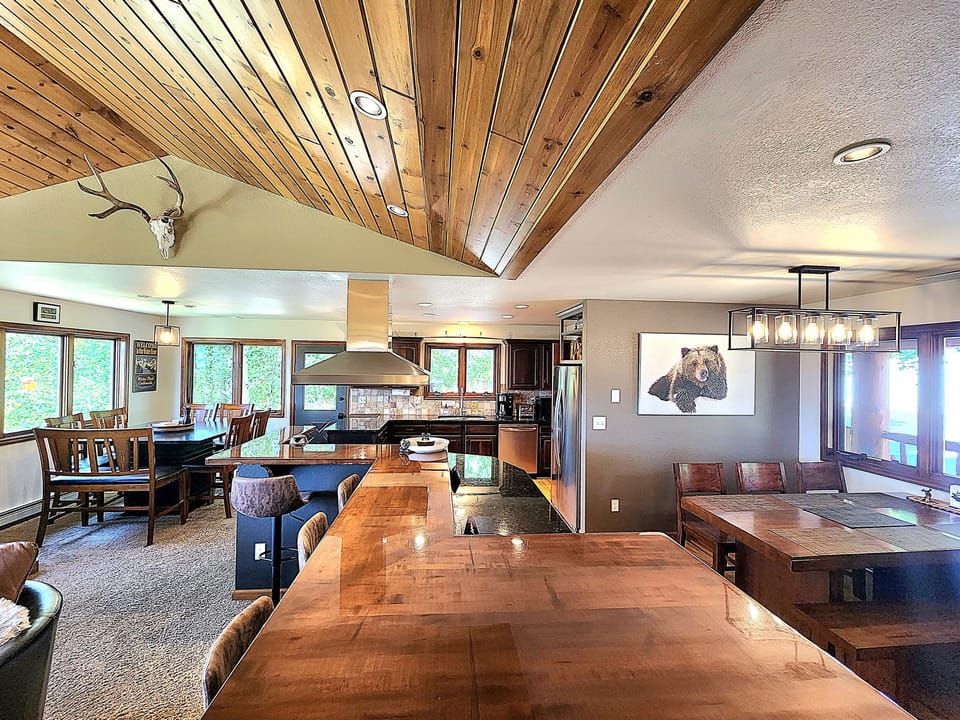 Kitchen showing both dining tables