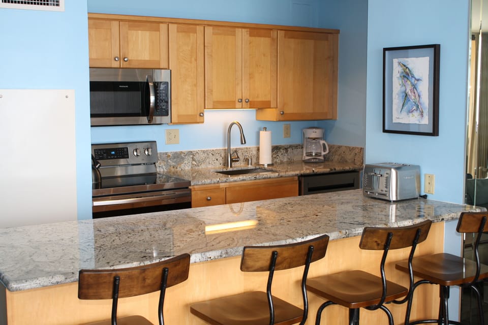 Fully stocked kitchen with new stainless steel appliances 