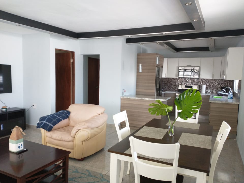 living room and dinning room with air conditioner, tv smart abd Wifi. 