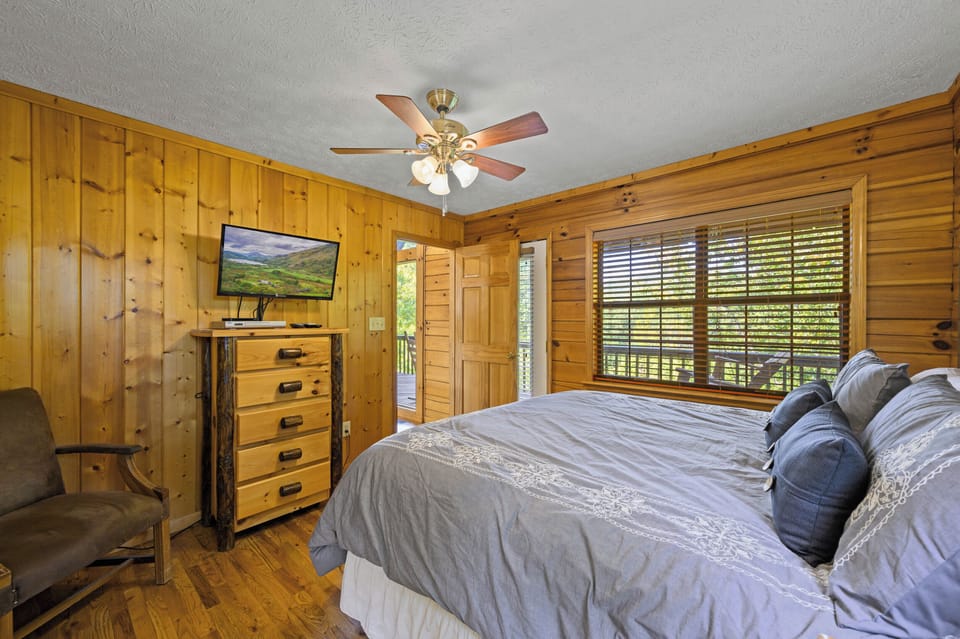 Master bedroom with door to living room and to deck.