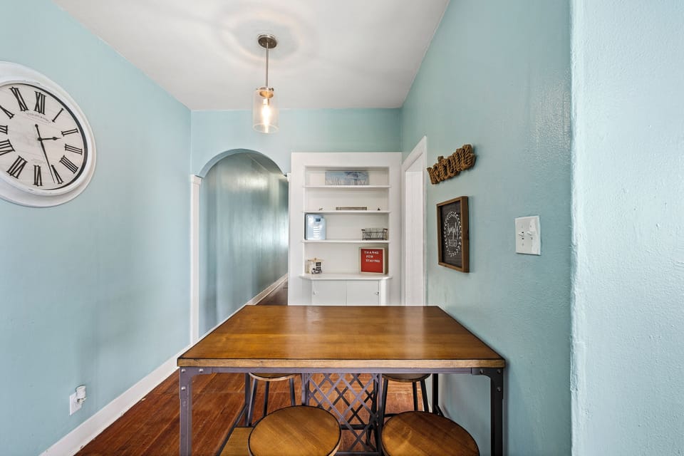 Dark cabinetry and quality appliances give the kitchen a polished, well-designed feel — cook in or order out, either way you are set.