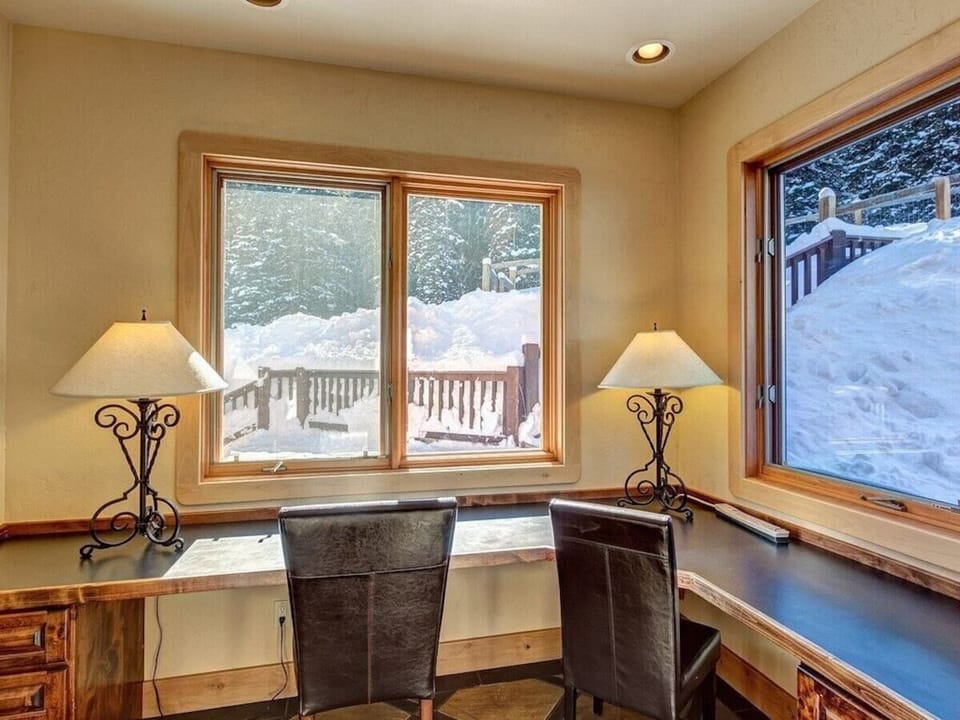 Office with desks for two off kitchen