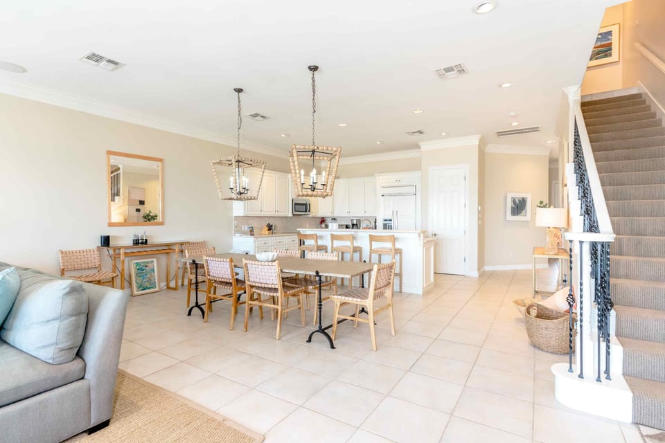 The primary rooms of our downstairs space include the living room, dining room, kitchen, half-bath, and a garage with pingpong table.