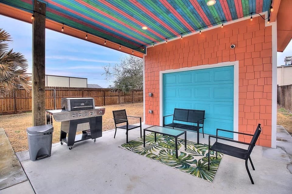 Festive Outdoor Living Area with Gas Grill