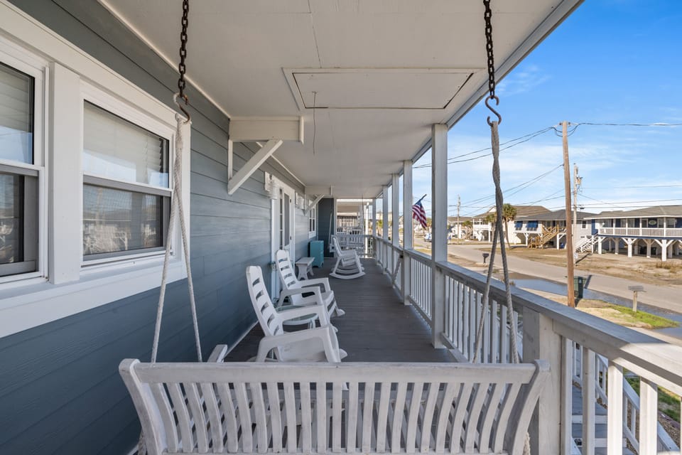 Lounge in one of the porch swings while enjoying a cool ocean breeze.