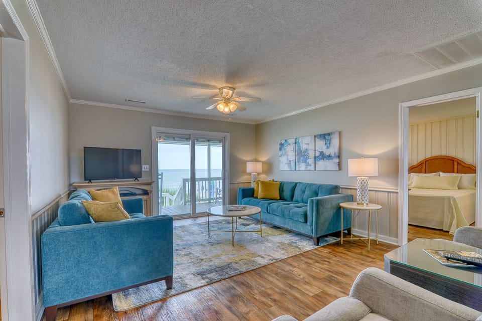 The ocean front living room is well-appointed with comfortable furnishings.