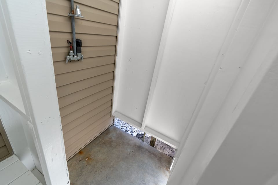 Rinse off the sand in the outdoor shower before heading inside.