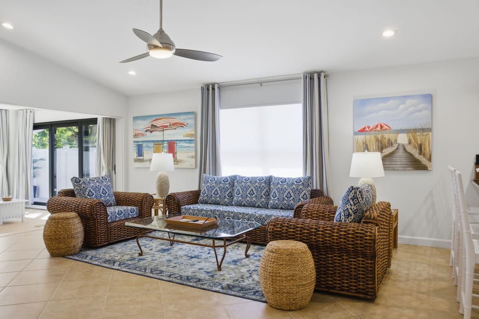 Spacious formal living room with 75" smart TV