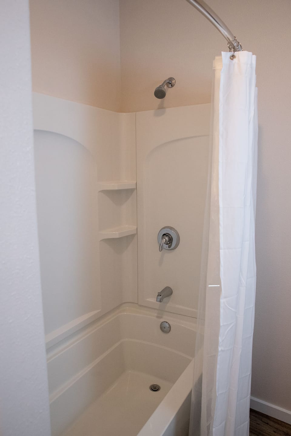 Bathroom with full tub/shower.