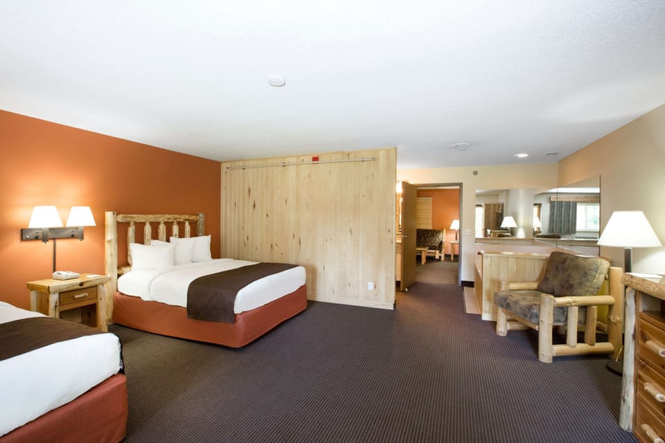 Premier Suite, 1 Bedroom, 2 Queen Beds, Jacuzzi, Fireplace, Balcony, Non Smoking | Desk, iron/ironing board, rollaway beds, free WiFi
