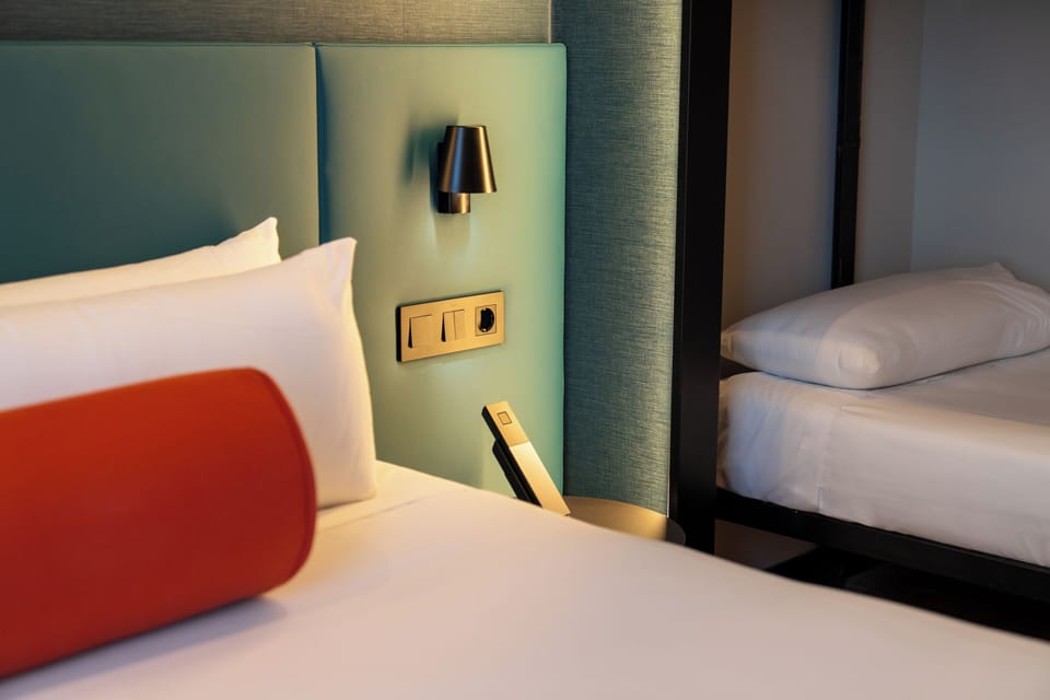 Quadruple Room | Minibar, in-room safe, desk, blackout drapes
