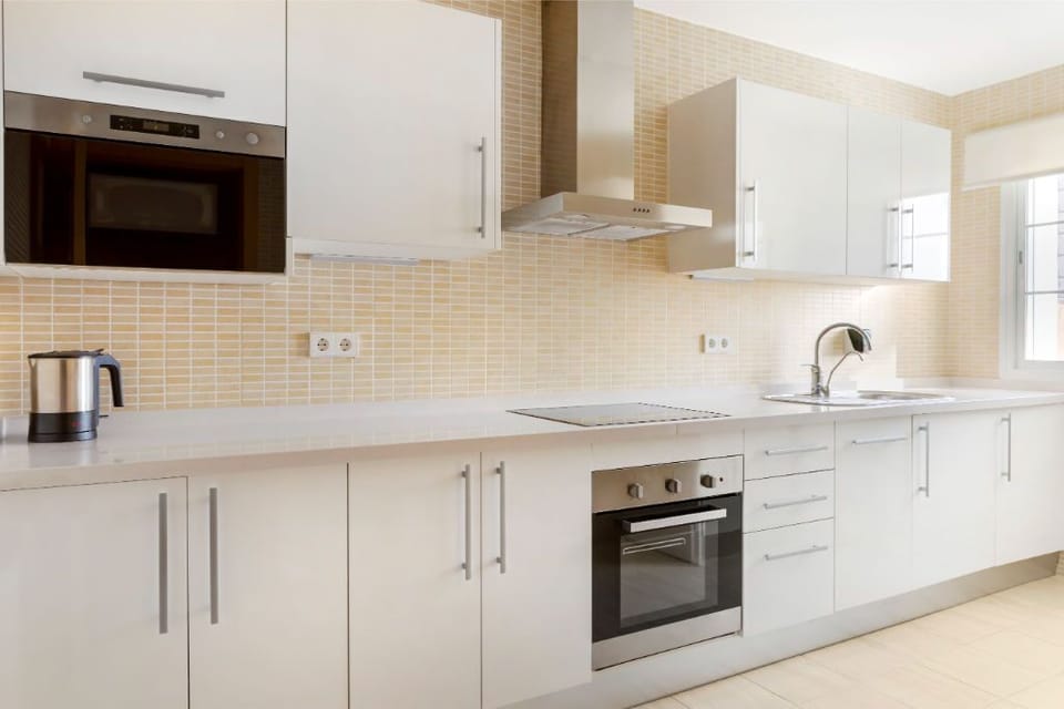 A sleek, modern kitchen with all the essentials, where functionality meets style for enjoyable meal prep.