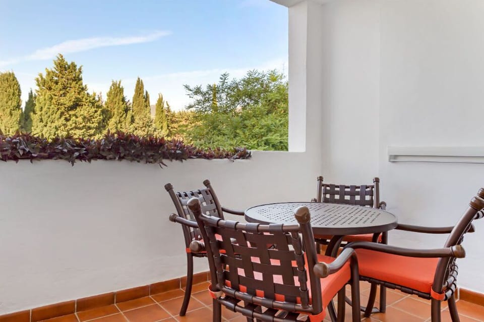 A cozy balcony setting with a view, ideal for sipping coffee and soaking in the surroundings.