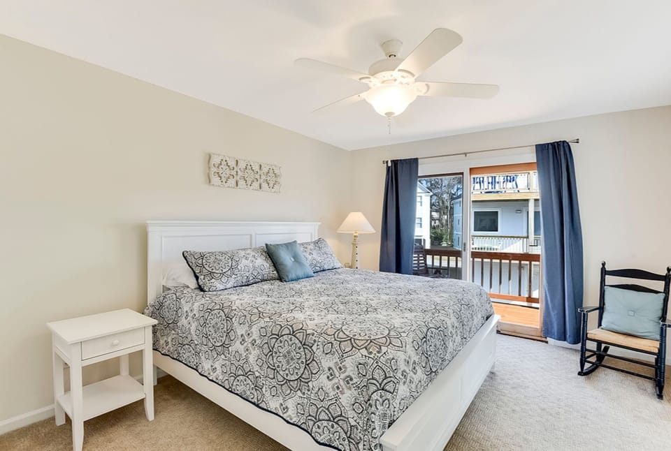 Mid level king bedroom with another private deck through the sliders