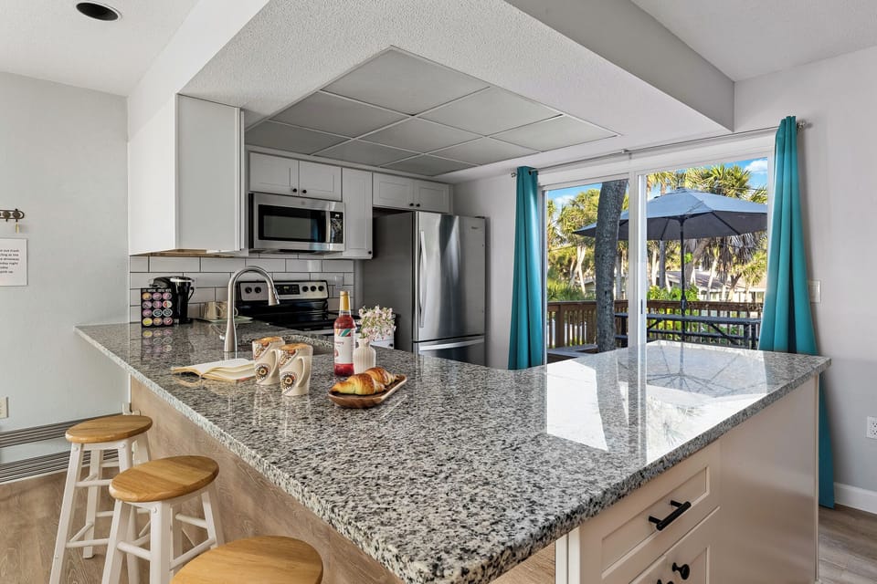 Newly remodeled, well stocked kitchen has all the room and wares you need.