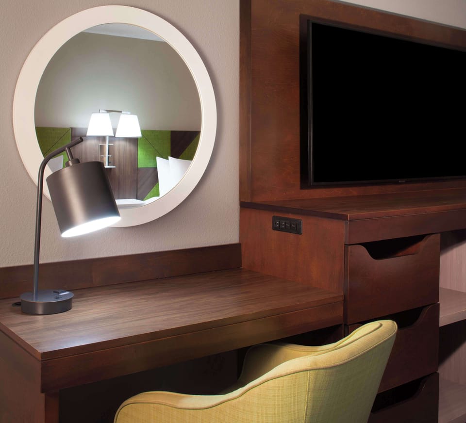 Desk, laptop workspace, blackout drapes, iron/ironing board