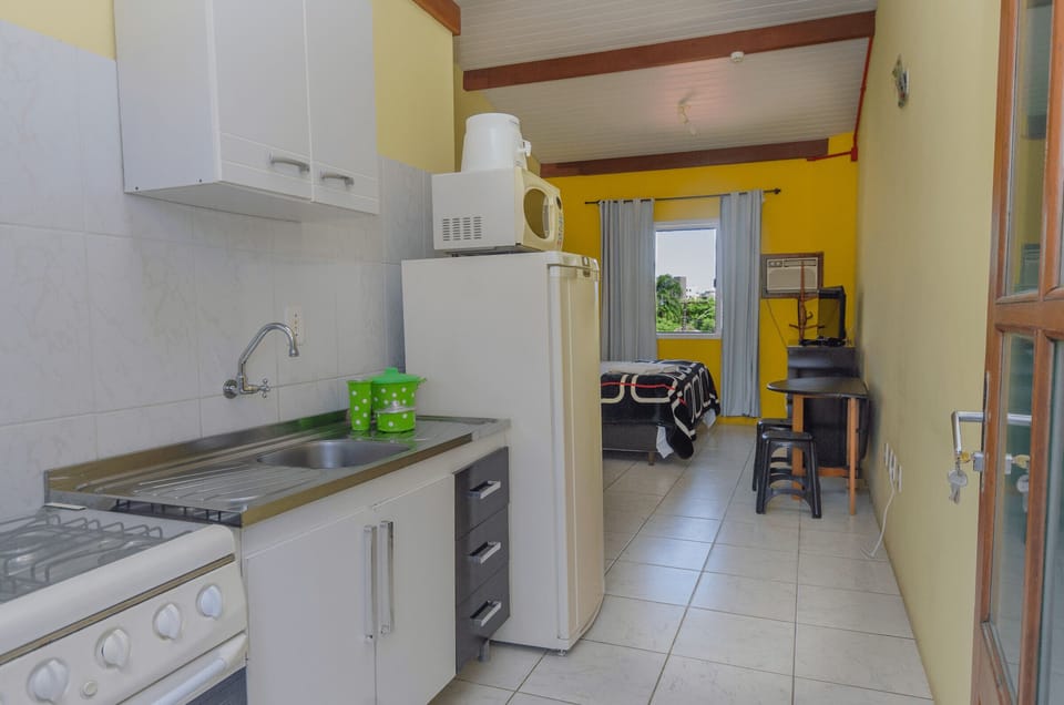 Fridge, microwave, stovetop, cookware/dishes/utensils