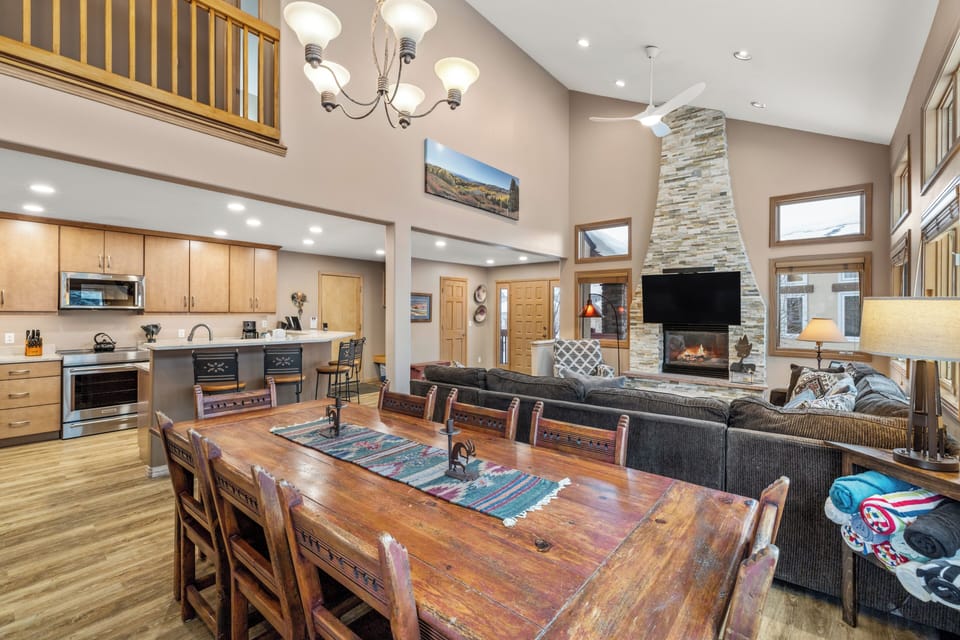 The living room and large dining table with room for 8. Tons of natural light!!