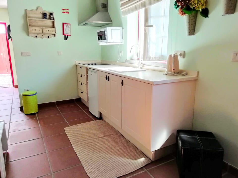 Studio | Private kitchenette | Microwave, electric kettle, highchair, dining tables
