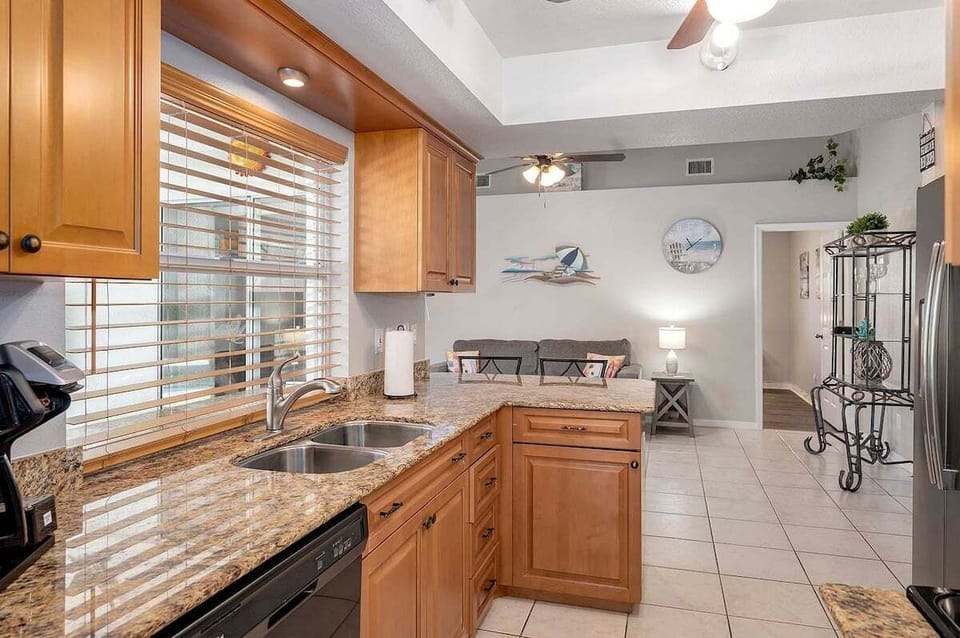 The Kitchen Has Beautiful Pool and Terrace Views