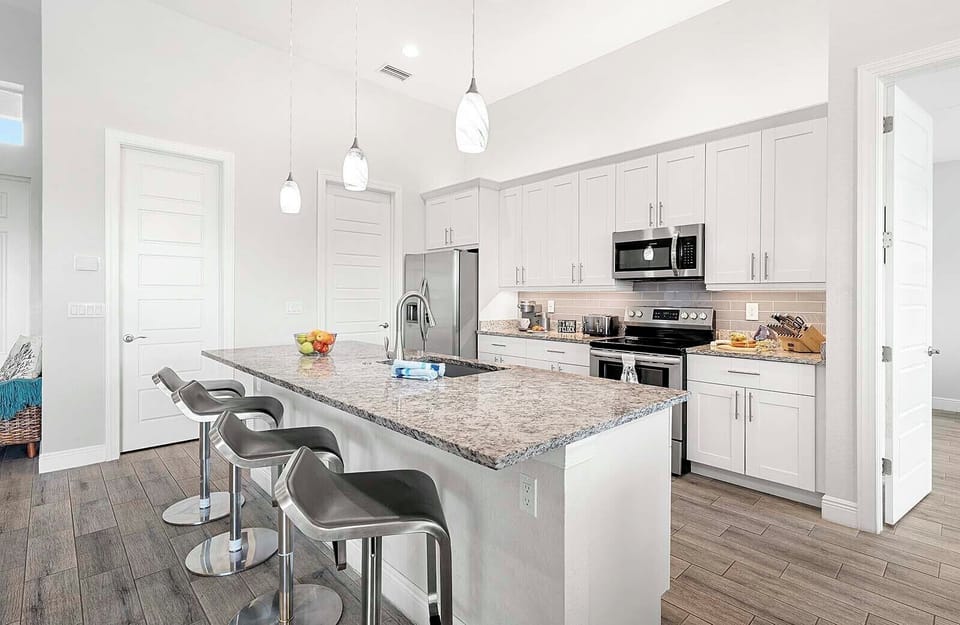 Large Island and Open Kitchen Concept serves as Great Entertainment Space