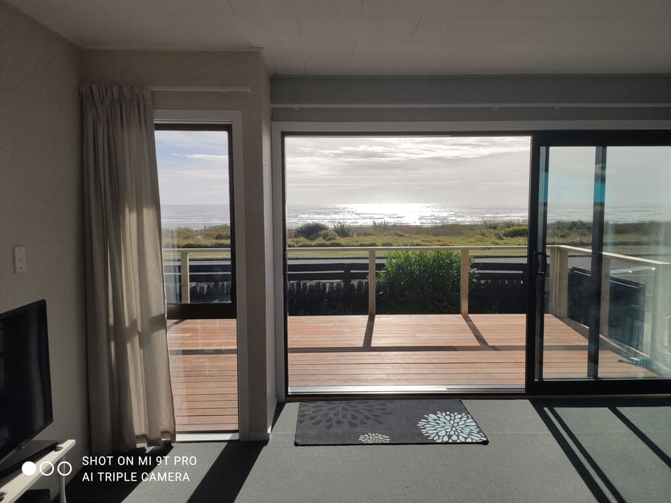 Lounge with direct access to deck.