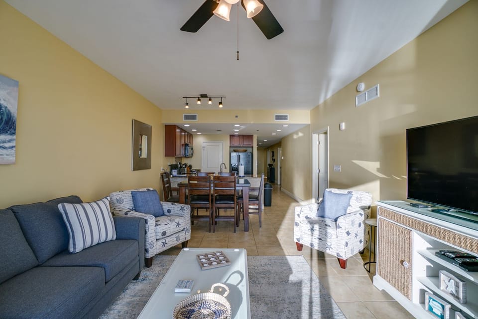 Your bright, open-plan living space features comfortable coastal decor, a full kitchen, and entertainment center for relaxing evenings.