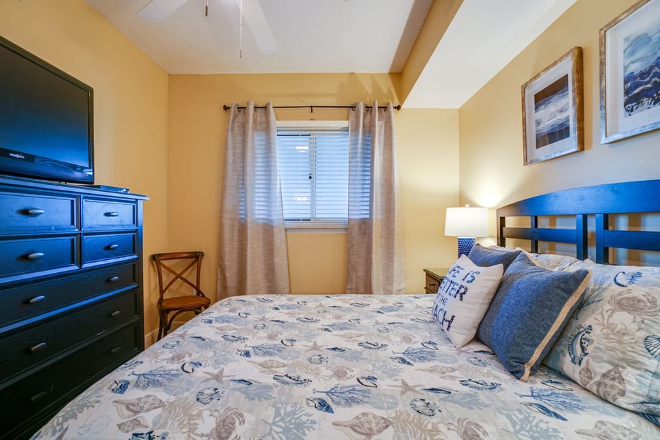 Drift off in your nautical-themed bedroom with crisp linens, warm lighting, and seaside charm throughout.