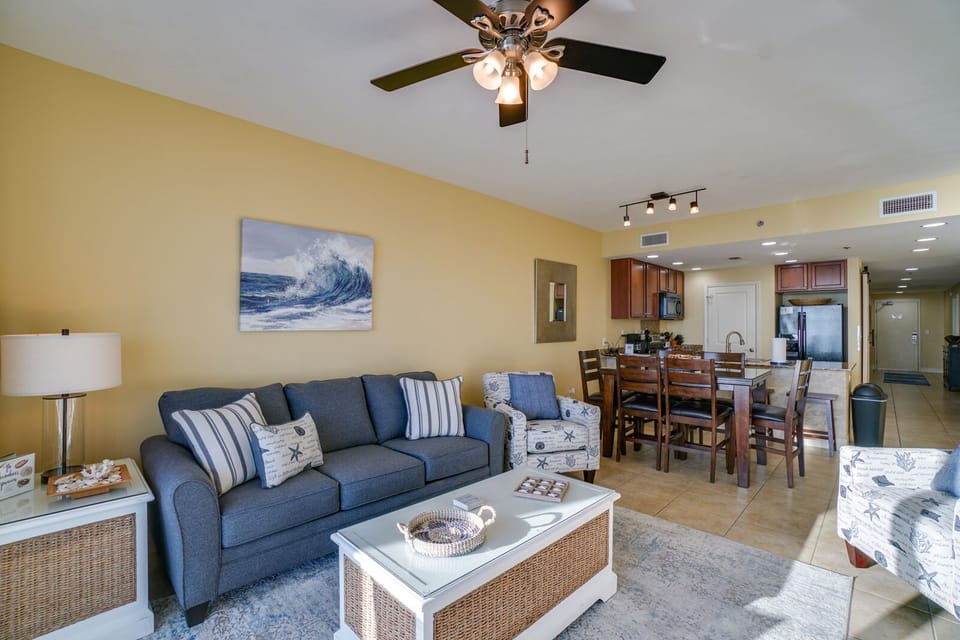Unwind in your spacious open-concept retreat, where coastal blues and warm woods create the perfect atmosphere for relaxation and memorable meals.