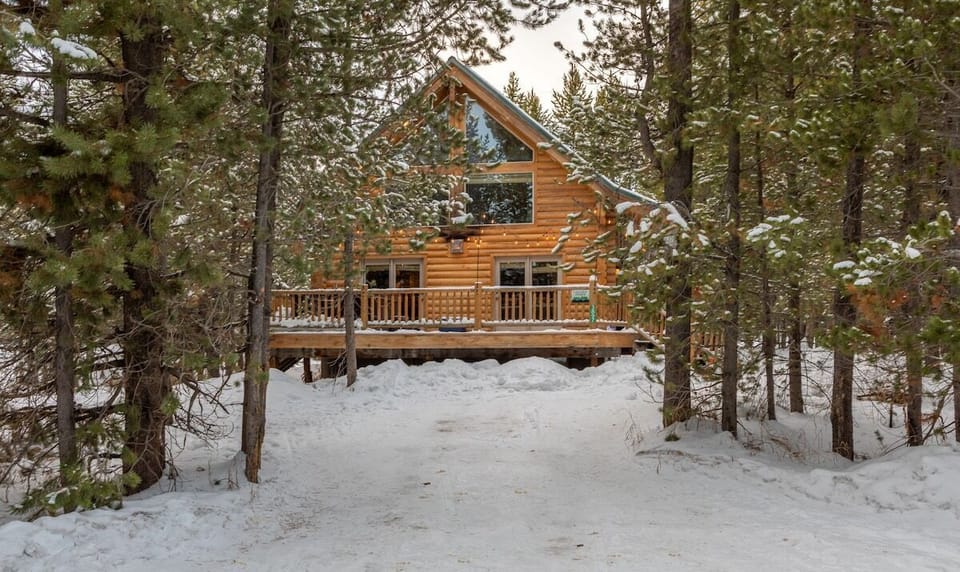 Our beautiful cabin nestled in the tall pines.