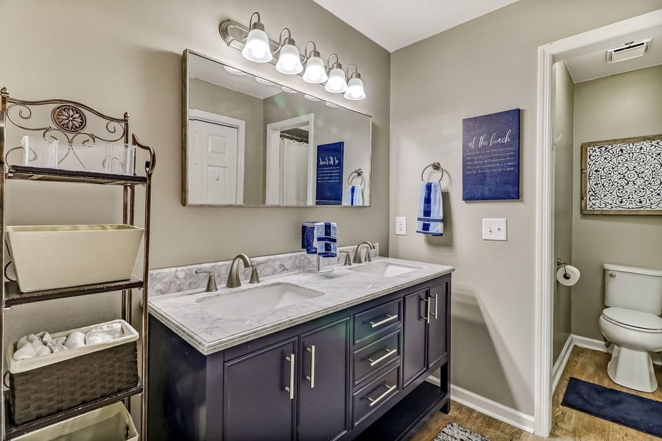 Completely Updated Master Bathroom with Double Sinks, Granite Countertops, a New Vanity, and a Seperate Water Closet