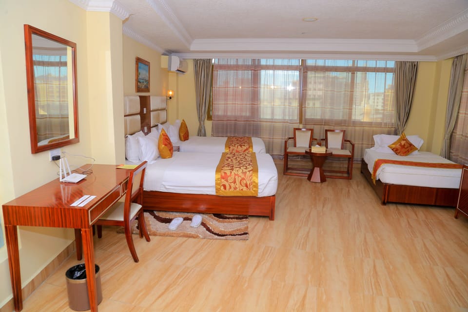 Grand Triple Room | Egyptian cotton sheets, in-room safe, desk, blackout drapes