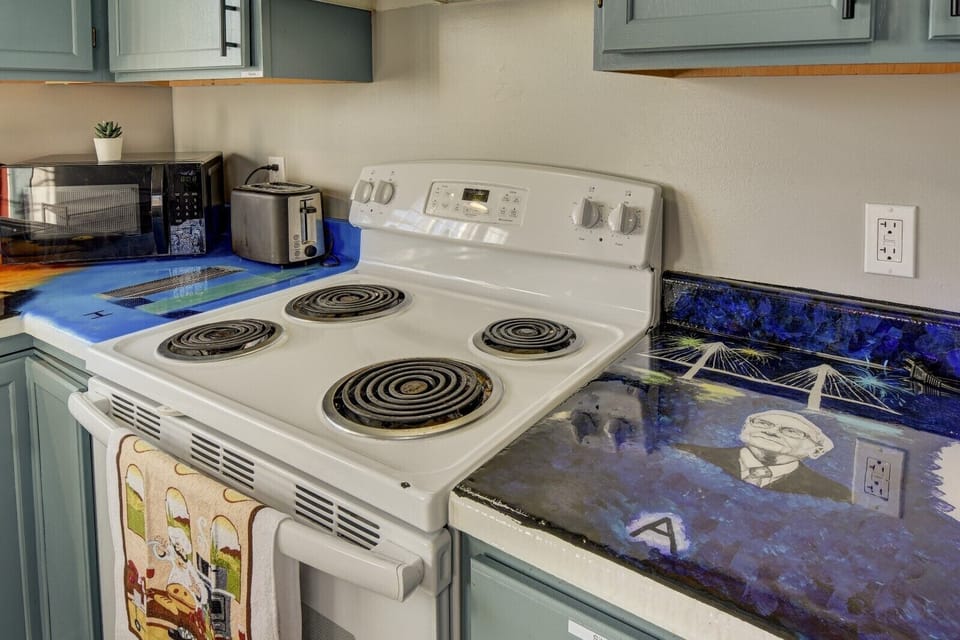 Local artist painted countertops, featuring Warren Buffet 